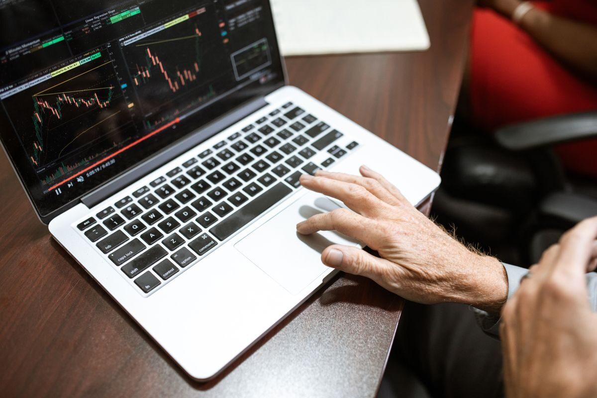 Analysing financial charts on a laptop