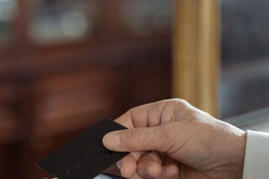 Hand holding a credit card ready to pay