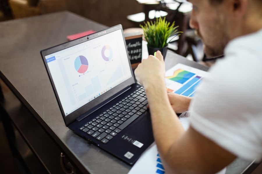 Reviewing investment performance charts on a laptop